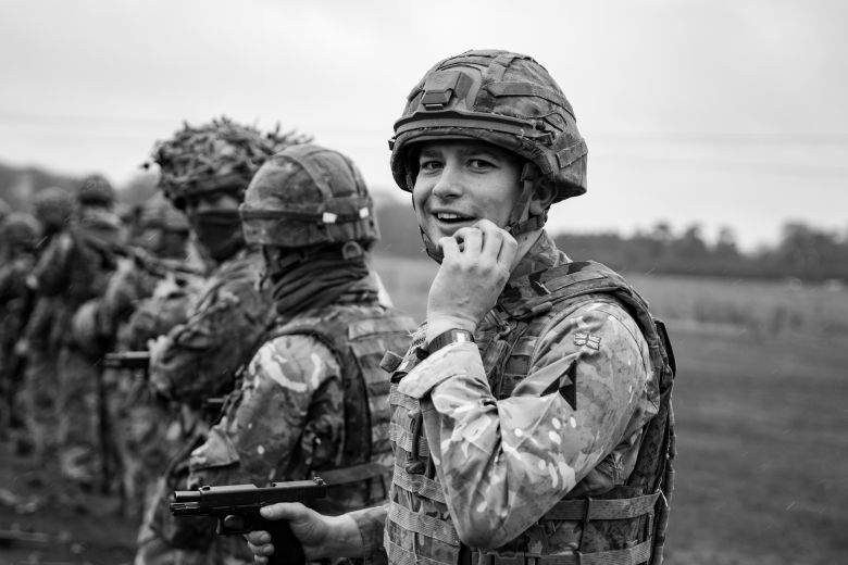 Young Soldier Looks towards camera with smile